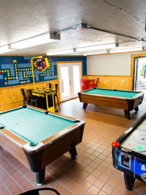 Game room with two pool tables